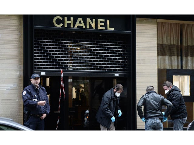 french police forensic experts prepare to enter the chanel jewellery store in paris on may 19 2016 photo afp french police forensic experts prepare to enter the chanel jewellery store in paris on may 19 2016 photo afp