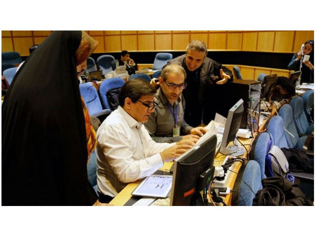 iranian journalists work in a press room at the interior ministry as they follow the preliminary results of the parliamentary and experts assembly elections on february 28 2016 in tehran photo afp iranian journalists work in a press room at the interior ministry as they follow the preliminary results of the parliamentary and experts assembly elections on february 28 2016 in tehran photo afp