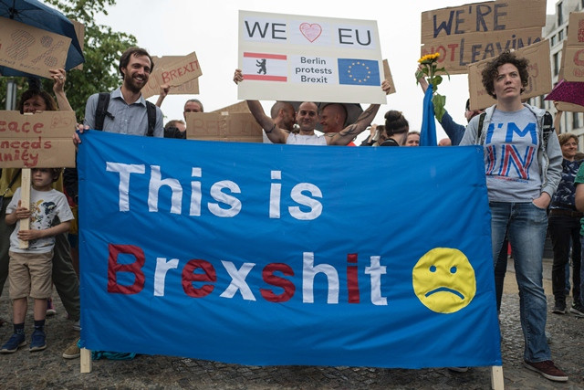 demonstrators hold a banner reading quot this is brexshit quot during a protest near britain 039 s embassy in berlin on july 2 2016 some 20 demonstrators mostly british expats living in berlin protested against the outcome of the recent quot brexit quot referendum expressing their allegiance to the eu photo afp demonstrators hold a banner reading quot this is brexshit quot during a protest near britain 039 s embassy in berlin on july 2 2016 some 20 demonstrators mostly british expats living in berlin protested against the outcome of the recent quot brexit quot referendum expressing their allegiance to the eu photo afp