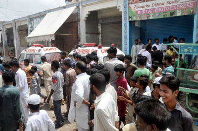 law and dis order korangi mob sets on fire two suspected robbers