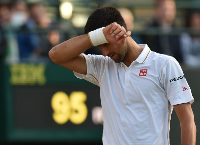 serbia 039 s novak djokovic reacts while playing us player sam querrey during their men 039 s singles third round match on the fifth day of the 2016 wimbledon championships at the all england lawn tennis club in wimbledon southwest london on july 1 2016 photo afp