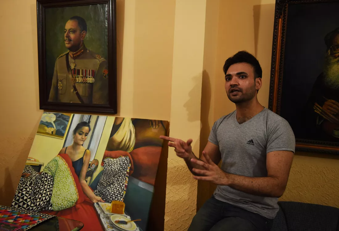 in this photograph taken on may 4 2016 mohammad ali a young pakistani artist shows his paintings at his studio in karachi photo afp in this photograph taken on may 4 2016 mohammad ali a young pakistani artist shows his paintings at his studio in karachi photo afp