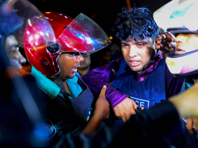 a bangladeshi policeman that was injured during an attack on an upscale restaurant is helped by others in dhaka on july 1 2016 photo afp a bangladeshi policeman that was injured during an attack on an upscale restaurant is helped by others in dhaka on july 1 2016 photo afp