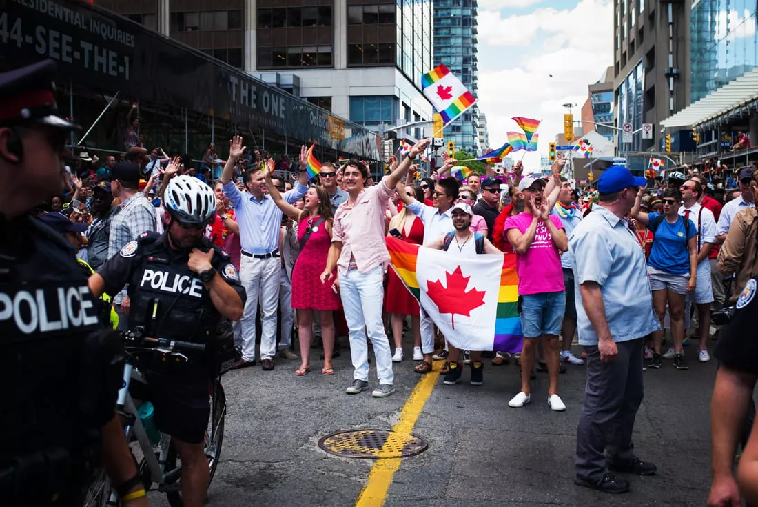 canadian prime minister justin trudeau middle waving flag participates at the annual pride festival parade july 3 2016 in toronto ontario canada photo afp canadian prime minister justin trudeau middle waving flag participates at the annual pride festival parade july 3 2016 in toronto ontario canada photo afp