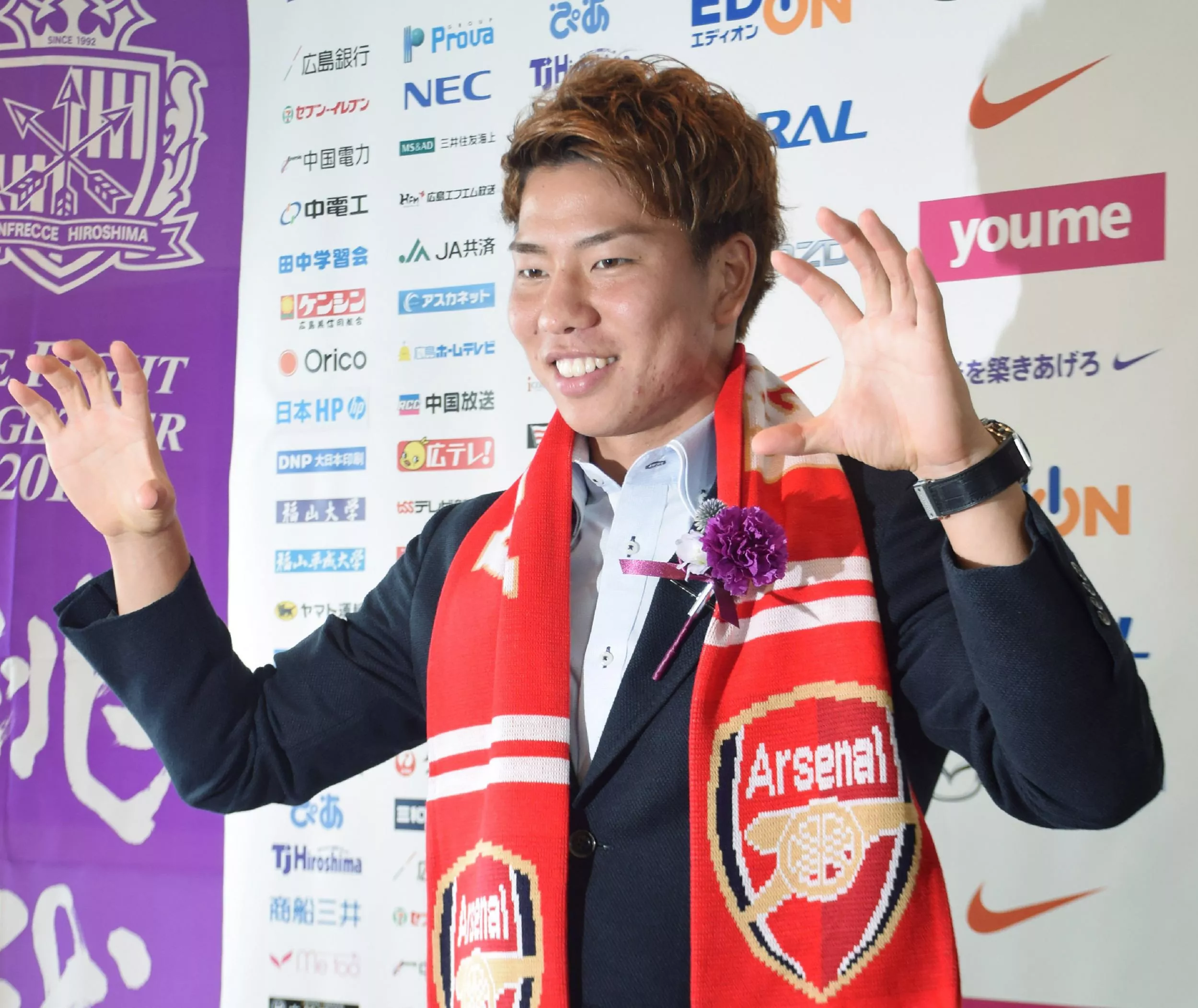 j league sanfrecce hiroshima forward takuma asano poses for the media in hiroshima on july 4 2016 photo afp j league sanfrecce hiroshima forward takuma asano poses for the media in hiroshima on july 4 2016 photo afp