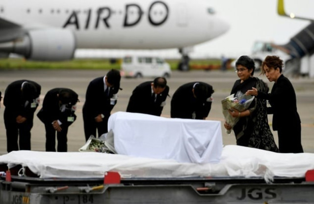 the bodies of seven japanese nationals killed in a bloody restaurant attack in dhaka were returned home early tuesday on a government plane photo afp the bodies of seven japanese nationals killed in a bloody restaurant attack in dhaka were returned home early tuesday on a government plane photo afp