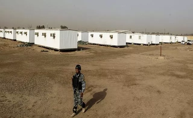 an iraqi soldier stands guard in the former u s military camp liberty which will be the new temporary camp for the iranian exile group the mujahideen khalq organization in baghdad photo reuters an iraqi soldier stands guard in the former u s military camp liberty which will be the new temporary camp for the iranian exile group the mujahideen khalq organization in baghdad photo reuters