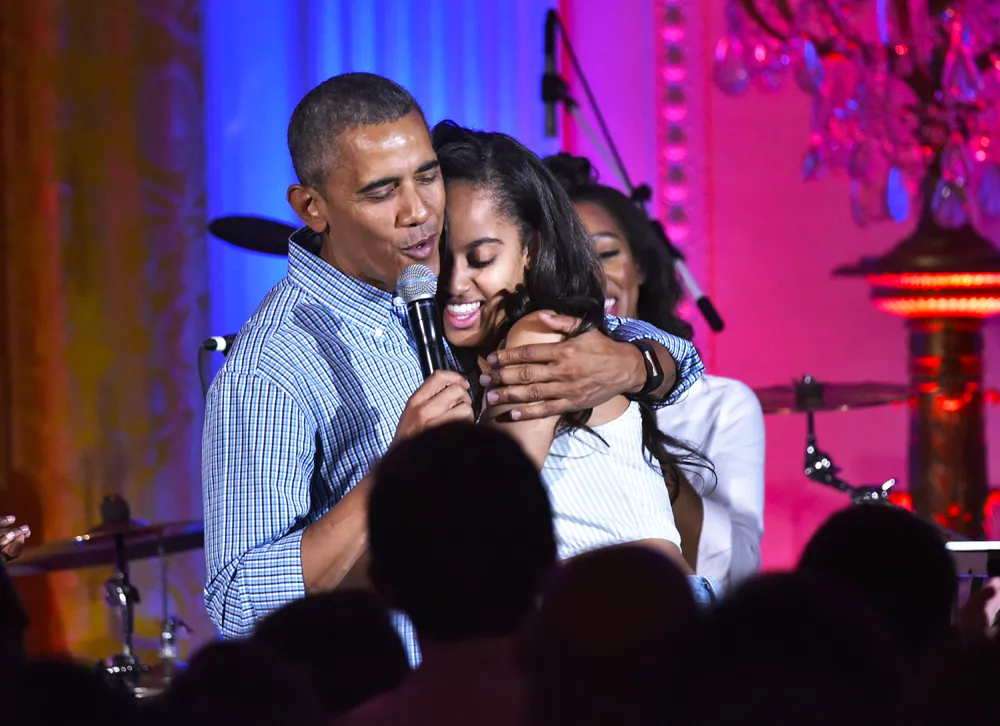 us president barack obama hugs his daughter malia on her birthday during an independence day celebration for military members and administration staff on july 4 2016 in the east room of the white house in washington dc photo afp us president barack obama hugs his daughter malia on her birthday during an independence day celebration for military members and administration staff on july 4 2016 in the east room of the white house in washington dc photo afp
