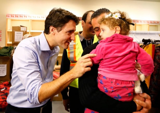 syrian refugees are greeted by canada 039 s prime minister justin trudeauat the toronto pearson international airport in mississauga ontario canada december 11 2015 photo reuters syrian refugees are greeted by canada 039 s prime minister justin trudeauat the toronto pearson international airport in mississauga ontario canada december 11 2015 photo reuters