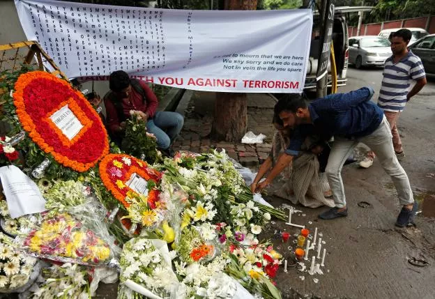 people place flowers at a makeshift memorial near the site to pay tribute to the victims of the attack on the holey artisan bakery and the o 039 kitchen restaurant in dhaka bangladesh july 5 2016 photo reuters people place flowers at a makeshift memorial near the site to pay tribute to the victims of the attack on the holey artisan bakery and the o 039 kitchen restaurant in dhaka bangladesh july 5 2016 photo reuters