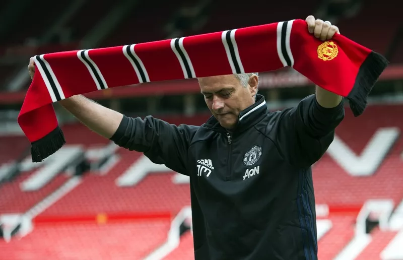jose mourinho poses with a scarf on the pitch during a photocall at old trafford stadium in manchester england on july 5 2016 photo afp jose mourinho poses with a scarf on the pitch during a photocall at old trafford stadium in manchester england on july 5 2016 photo afp