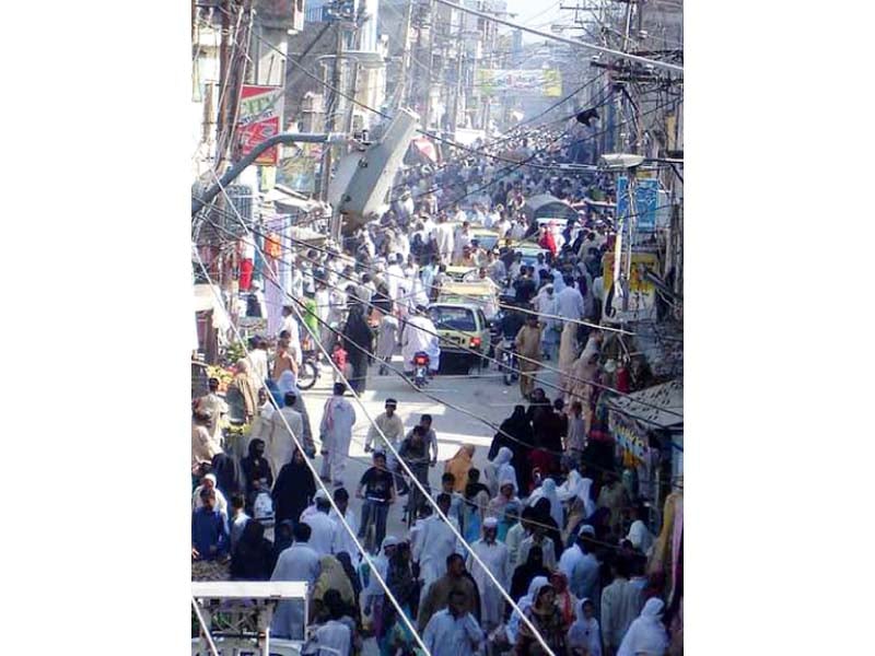 a large number of people throng tench bhatta market during eid season photo file