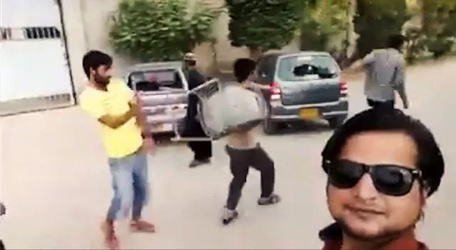this screen grab shows employees chanting slogans against factory owners as they vandalise vehicles parked outside a factory in karachi 039 s korangi area this screen grab shows employees chanting slogans against factory owners as they vandalise vehicles parked outside a factory in karachi 039 s korangi area