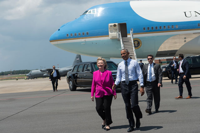 us president barack obama and democratic presidential candidate hillary clinton walk to greet wellwishers upon arrival in charlotte north carolina to attend a clinton campaign event photo afp