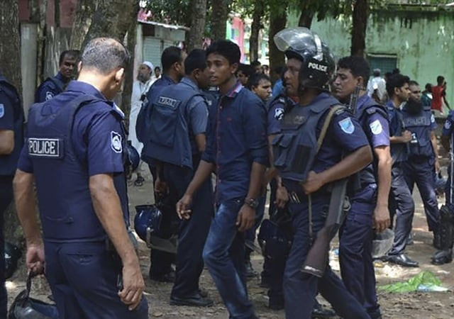 police detain a suspected militant following an attack near bangladesh s largest eid prayer gathering in kishoreganj some 130km from dhaka on july 7 photo afp police detain a suspected militant following an attack near bangladesh s largest eid prayer gathering in kishoreganj some 130km from dhaka on july 7 photo afp