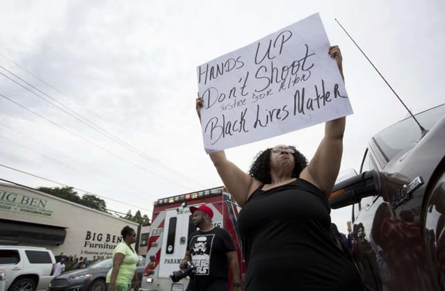 community members demonstate after a vigil in memory of alton stering who was shot dead by police at the triple s food mart in baton rouge louisiana us july 6 2016 photo reuter community members demonstate after a vigil in memory of alton stering who was shot dead by police at the triple s food mart in baton rouge louisiana us july 6 2016 photo reuter