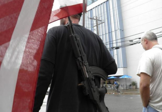 pro gun advocates take to the streets outside the university of texas ahead of a 039 mock mass shooting 039 event where they used cardboard cut outs rifles the simulated bangs of bullets on bullhorns and doused fake victims with fake blood in austin texas us on december 12 2015 photo reuters