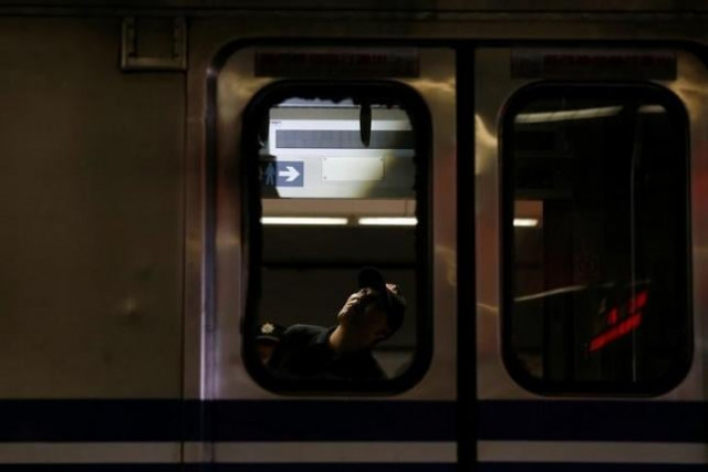 a policeman is seen through the broken windows of a train after an explosion at the songshan train station in taipei taiwan july 7 2016 photo reuters