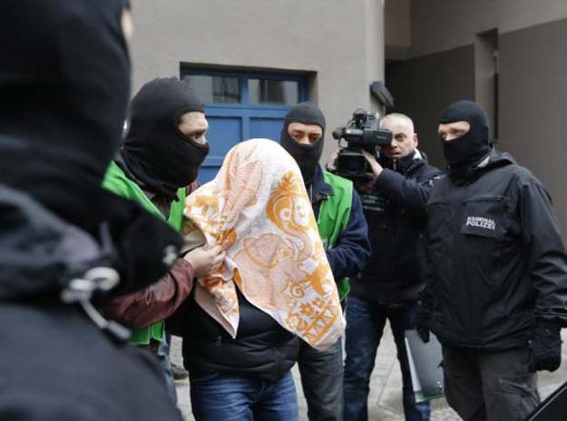 a suspect is detained by plain clothes police during a raid at a house in the kreuzberg district of berlin germany february 4 2016 photo reuters file