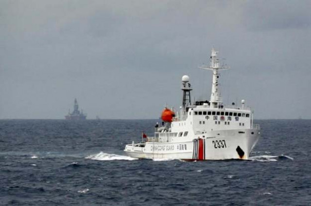 a chinese coast guard vessel r passes near the chinese oil rig haiyang shi you 981 l in the south china sea about 210 km 130 miles from the coast of vietnam june 13 2014 photo reuters a chinese coast guard vessel r passes near the chinese oil rig haiyang shi you 981 l in the south china sea about 210 km 130 miles from the coast of vietnam june 13 2014 photo reuters