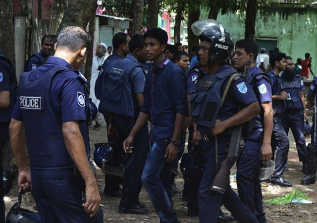 bangladeshi police detain a suspected militant following an attack near bangladesh s largest eid prayer rally in kishoreganj some 130km from dhaka on july 7 2016 photo afp bangladeshi police detain a suspected militant following an attack near bangladesh s largest eid prayer rally in kishoreganj some 130km from dhaka on july 7 2016 photo afp