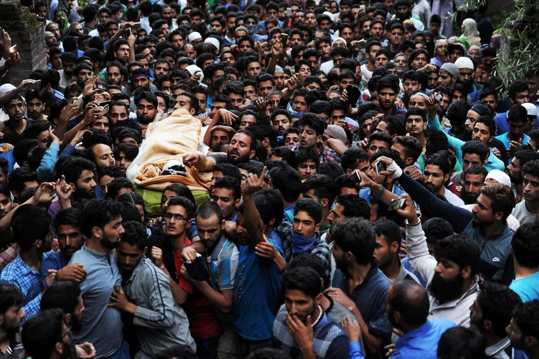 kashmiri mourners carry the body of burhan muzaffar wani the new age poster boy for the rebel movement in the restive himalayan state of jammu and kashmir ahead of his funeral in tral his native town 42kms south of srinagar on july 9 2016 photo afp kashmiri mourners carry the body of burhan muzaffar wani the new age poster boy for the rebel movement in the restive himalayan state of jammu and kashmir ahead of his funeral in tral his native town 42kms south of srinagar on july 9 2016 photo afp
