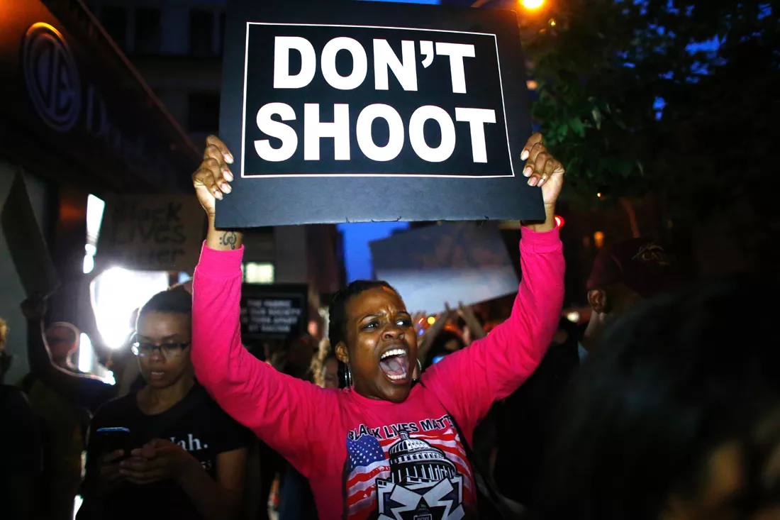 a woman holds a banner during a protest in support of the black lives matter movement in new york on july 09 2016 photo afp a woman holds a banner during a protest in support of the black lives matter movement in new york on july 09 2016 photo afp