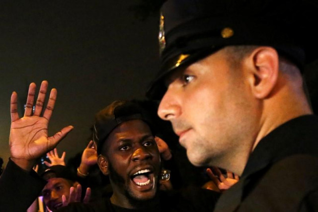 a protester shouts quot look at me quot towards a nypd police officer during a march against police brutality in manhattan new york us july 9 2016 photo reuters a protester shouts quot look at me quot towards a nypd police officer during a march against police brutality in manhattan new york us july 9 2016 photo reuters
