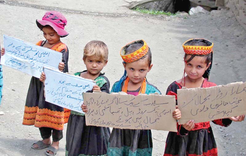 children of kalash tribe hold placards during protest photo inp