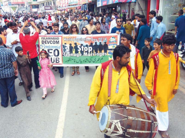 a walk is held in murree in connection with world population day calling for an end to child marriages photo express a walk is held in murree in connection with world population day calling for an end to child marriages photo express