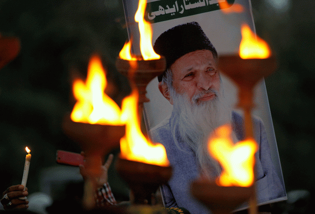 people hold a candle light vigil to mourn the death of philanthropist abdul sattar edhi in lahore photo reuters