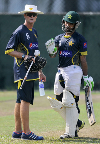 asad shafiq has a chat with grant flower l in colombo sri lanka on august 13 2014 photo afp asad shafiq has a chat with grant flower l in colombo sri lanka on august 13 2014 photo afp