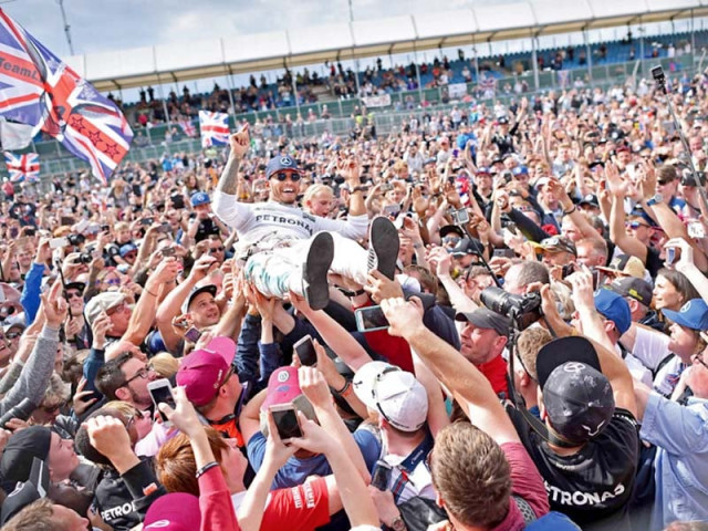 hamilton equalled fellow briton nigel mansell s record of four silverstone wins by completing a hat trick on sunday photo afp hamilton equalled fellow briton nigel mansell s record of four silverstone wins by completing a hat trick on sunday photo afp