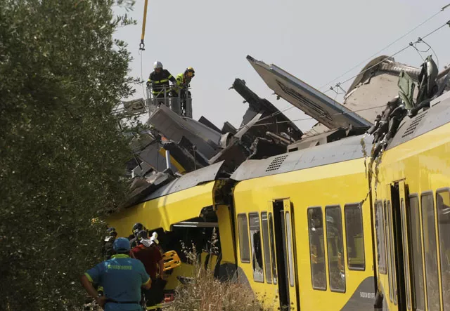 firefighters work at the site where two passenger trains collided in the middle of an olive grove in the southern village of corato near bari italy july 12 2016 photo reuters firefighters work at the site where two passenger trains collided in the middle of an olive grove in the southern village of corato near bari italy july 12 2016 photo reuters
