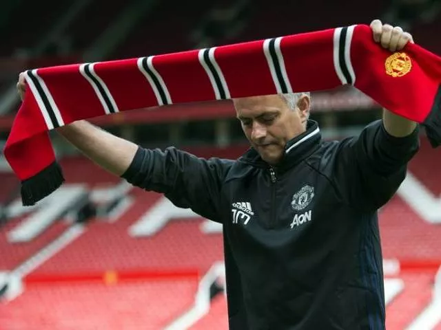 jose mourinho poses with a scarf on the pitch during a photocall at old trafford stadium in manchester england on july 5 2016 photo afp jose mourinho poses with a scarf on the pitch during a photocall at old trafford stadium in manchester england on july 5 2016 photo afp