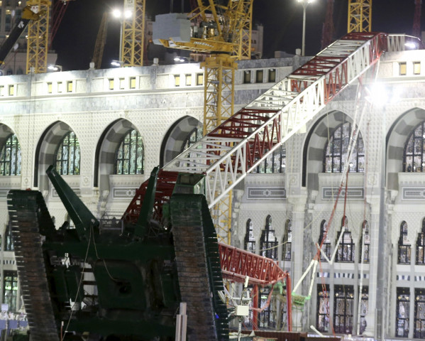 saudi emergency crew stand near a construction crane after it crashed in the grand mosque in the muslim holy city of mecca saudi arabia september 11 2015 photo reuters saudi emergency crew stand near a construction crane after it crashed in the grand mosque in the muslim holy city of mecca saudi arabia september 11 2015 photo reuters