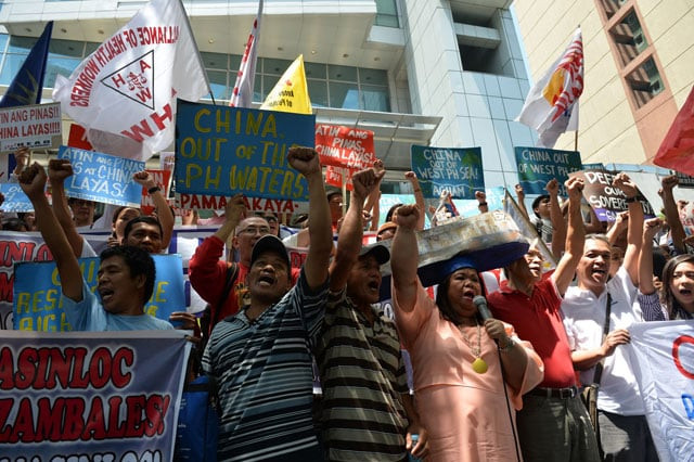 activists hold placards during a protest in front of the chinese consulate in manila on july 12 2016 ahead of a un tribunal ruling on the legality of china 039 s claims to an area of the south china sea contested by the philippines photo afp activists hold placards during a protest in front of the chinese consulate in manila on july 12 2016 ahead of a un tribunal ruling on the legality of china 039 s claims to an area of the south china sea contested by the philippines photo afp