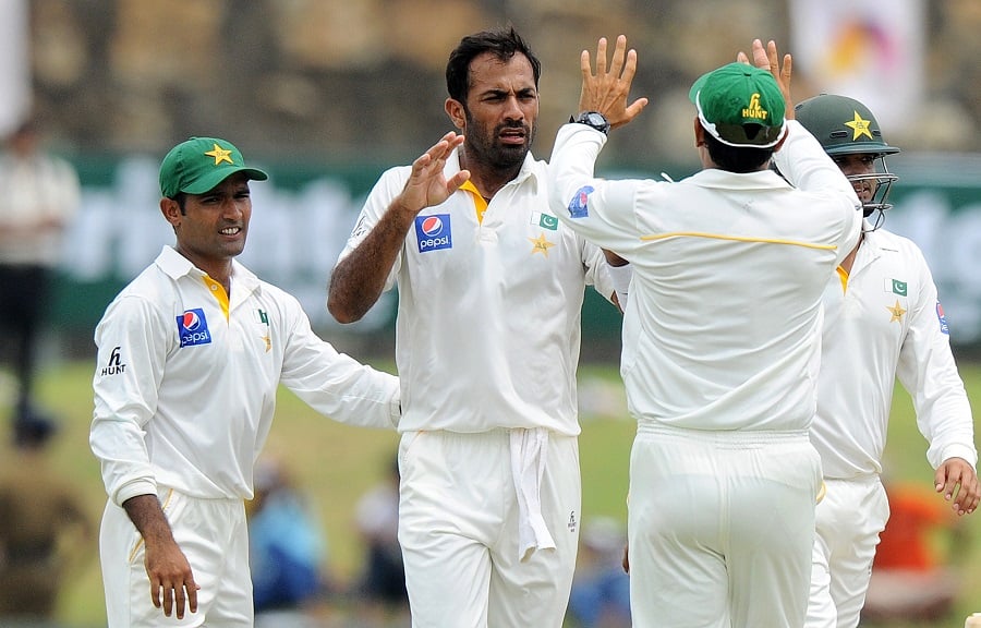 this picture was taken on june 18 2015 when wahab riaz 2l and teammates celebrate the dismissal of unseen sri lankan batsman dimuth karunaratne during the second day of the opening test cricket match at the galle international cricket stadium in galle photo afp