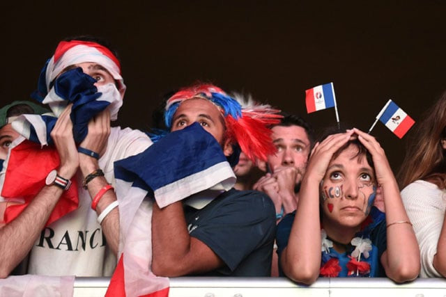 portuguese tourism officials on tuesday invited the france supporter who was consoled by a young portugal fan following the hosts narrow euro 2016 defeat in images that have taken the internet by storm photo afp