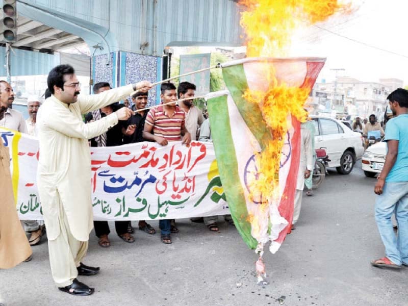 pml n workers burning an indian flag at the demonstration held at kacheri chowk multan photo online