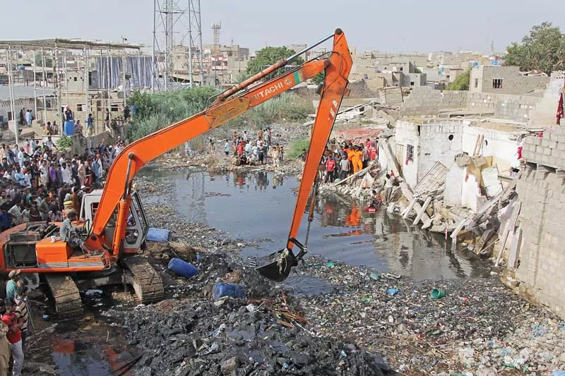 three people drowned in this storm water drain when a 10 room two storey house collapsed the incident apparently took place when kmc s heavy machinery was cleaning the drain at samnabad some 30 to 40 kilometres away from the incident site photo aysha saleem express three people drowned in this storm water drain when a 10 room two storey house collapsed the incident apparently took place when kmc s heavy machinery was cleaning the drain at samnabad some 30 to 40 kilometres away from the incident site photo aysha saleem express