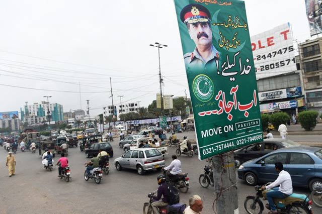 campaigners set up banners urging general raheel to impose martial law and take control of the country photo afp