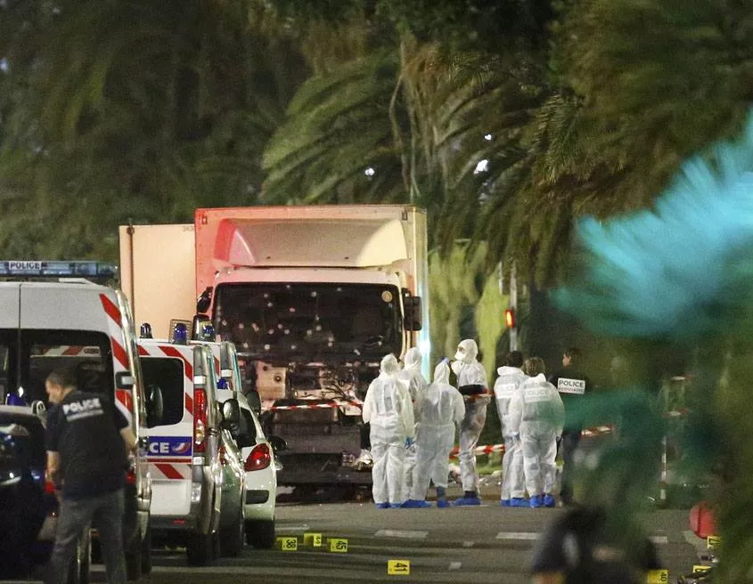 french police forces and forensic officers stand next to a truck july 15 2016 that ran into a crowd celebrating the bastille day national holiday on the promenade des anglais killing at least 60 people in nice france july 14 photo french police forces and forensic officers stand next to a truck july 15 2016 that ran into a crowd celebrating the bastille day national holiday on the promenade des anglais killing at least 60 people in nice france july 14 photo