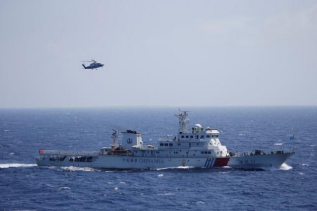 chinese ship and helicopter are seen during a search and rescue exercise near qilian yu subgroup in the paracel islands which is known in china as xisha islands south china sea july 14 2016 photo reuters