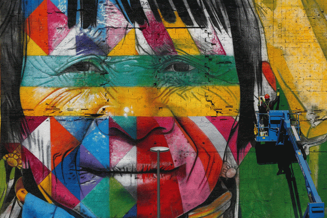 a graffiti artist works on a wall as he creates a massive mural on rio 039 s olympic boulevard featuring native people from five continents ahead of the rio 2016 olympic games in rio de janeiro brazil photo reuters