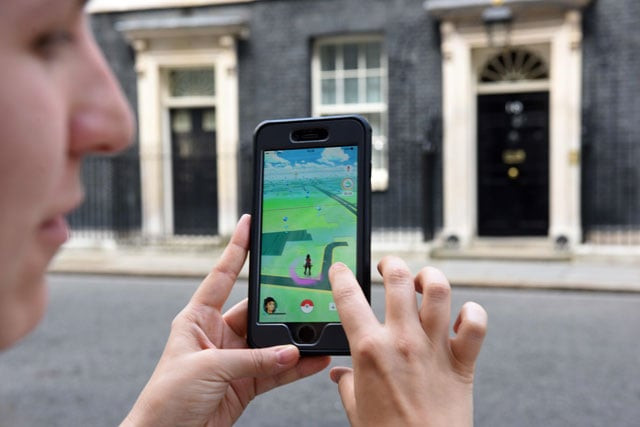 a picture taken on july 14 2016 shows an avatar on the screen of a mobile phone as a player uses the pokemon go application on their mobile phones as they wait with members of the media opposite the door of 10 downing street in central london photo afp a picture taken on july 14 2016 shows an avatar on the screen of a mobile phone as a player uses the pokemon go application on their mobile phones as they wait with members of the media opposite the door of 10 downing street in central london photo afp