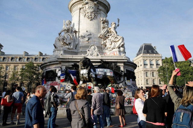 people gather at the place de la republique square in paris to pay tribute to the victims photo afp