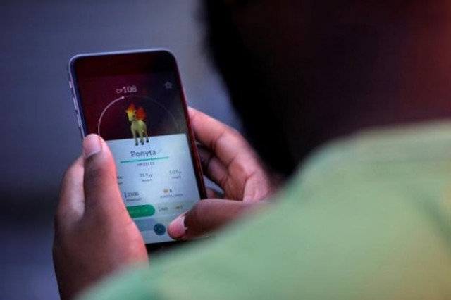 a person playing the augmented reality mobile game quot pokemon go quot by nintendo photo reuters a person playing the augmented reality mobile game quot pokemon go quot by nintendo photo reuters