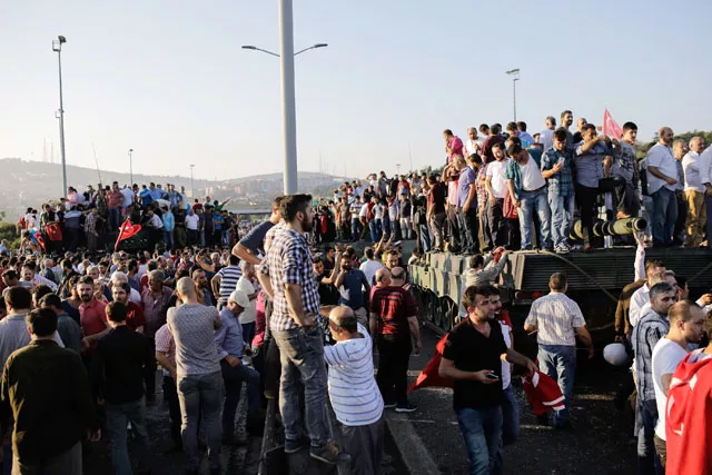 people celebrate on a military tank after they took over military position on the bosphorus bridge in istanbul on july 16 2016 photo afp people celebrate on a military tank after they took over military position on the bosphorus bridge in istanbul on july 16 2016 photo afp