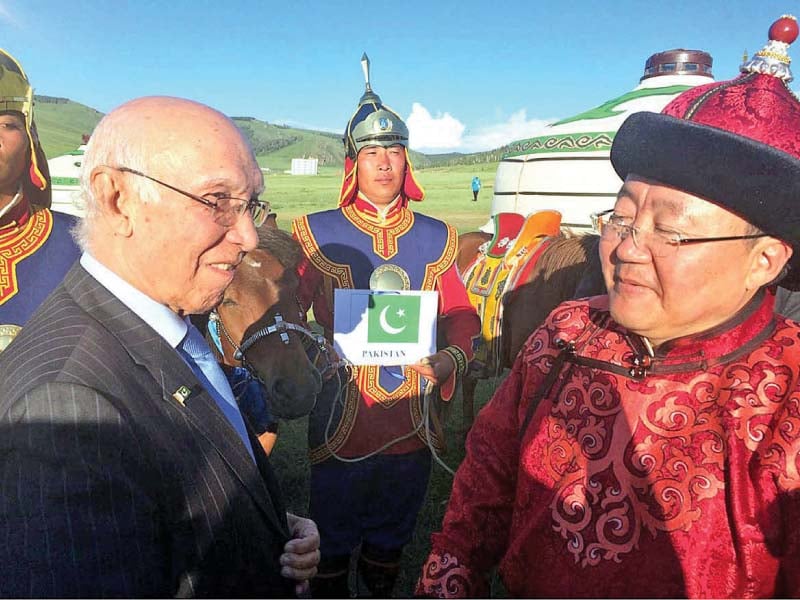 mongolia s of president tsakhiagiin elbegdorj presents a mongolian horse to sartaj aziz during the asem summit in ulan battor photo app